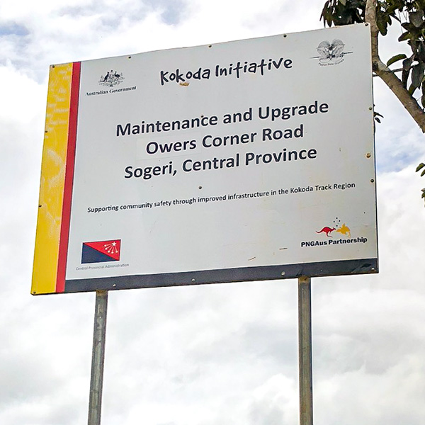 A sign showing the Kokoda Initiative. An evaluation report called: Preliminary Findings: Evaluation of the Kokoda Initiative, was published by the Oxford Policy Management for the Australian Department of Foreign Affairs and Trade, Papua New Guinea, 2020.